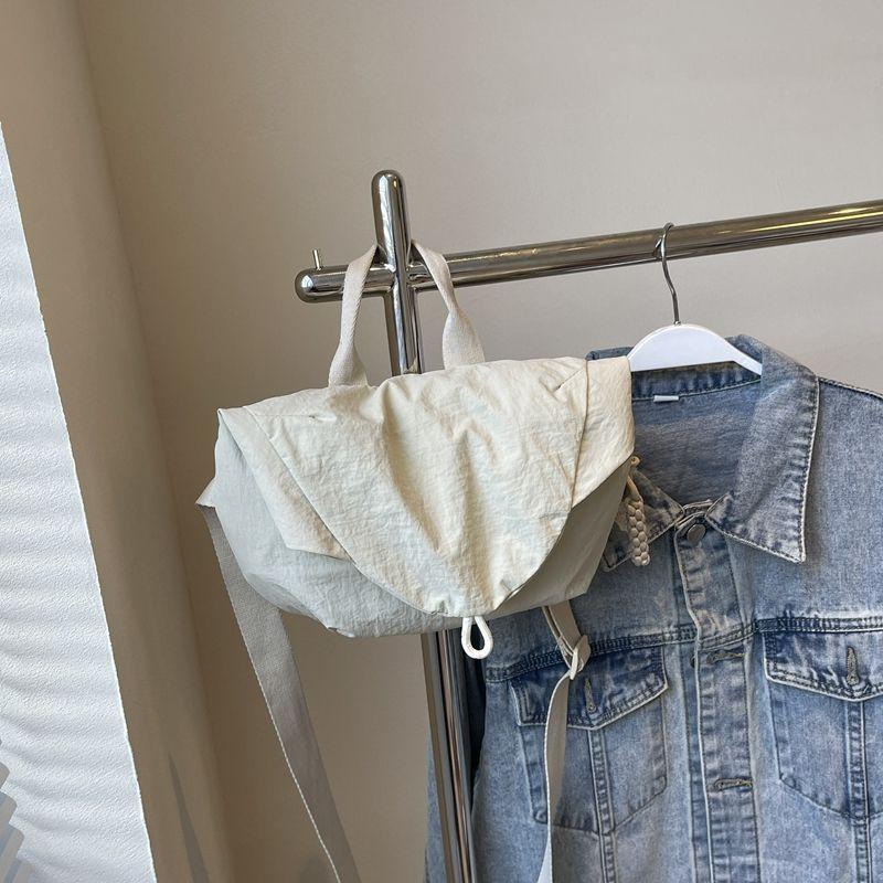 

Korean version of casual portable dumpling bag new lightweight shoulder messenger bag niche personality versatile sports fanny pack