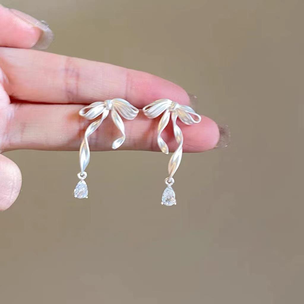 Elegant Bow Ribbon Zirconia Stud Earrings for Women with S925 Silver Needles - Sweet, High-End Celebrity Style.