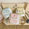 High-value girls toilet bag, simple casual small backpack, cute bow floral college style flip backpack.