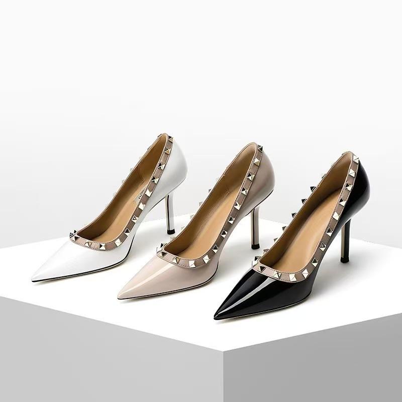 Spring and summer new rivet pointed high heels women's thin heel leather black patent leather OL nightclub super high heel single shoes