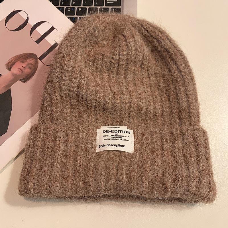 Chapeau de laine coréen doux et mignon à grosse tête Automne et hiver Décontracté Polyvalent Chapeau de tête Coupe-vent Oreilles chaudes Chapeau tricoté