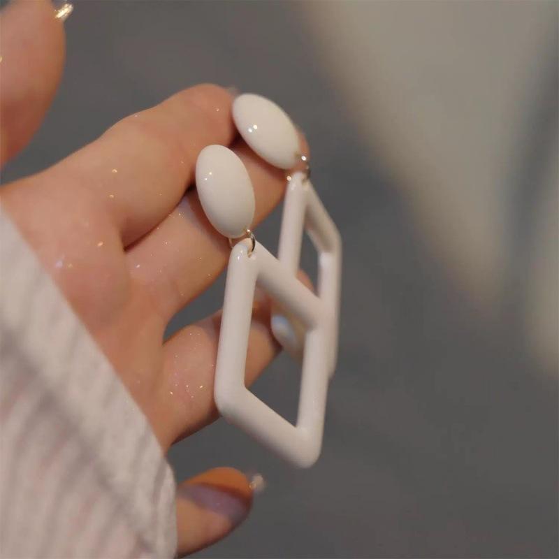 French personalized milky white retro earrings simple hollow rhombus geometric stud earrings women's fashion versatile ear jewelry earrings