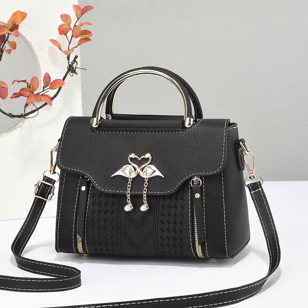 The Lady Is Carrying A Sweet Single-shoulder Bag with A Large Capacity for Daily Commuting, A Crossbody Bag.