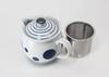This 10cm Diameter, 450ml Teapot Features a Rounded Shape and Numerous Large and Small Circular Patterns. It Includes a Super-fine Stainless Steel