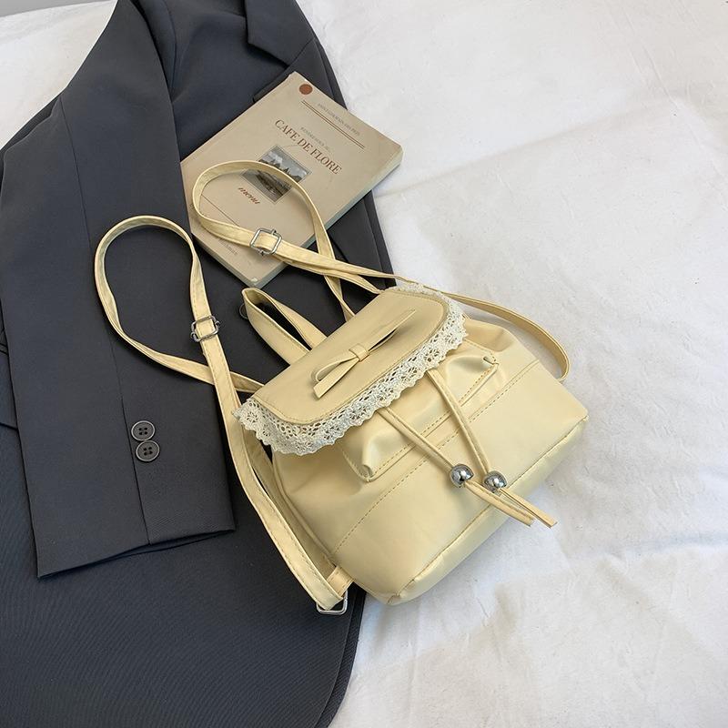 

Студенческий маленький рюкзак женский новый модный кружевной рюкзак нишевый сумочка в балетном стиле жёлтый