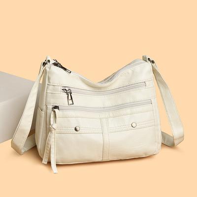 Una borsa da donna alla moda per tutte le stagioni in morbida pelle, multicomparto, multipocket, con cuciture, borsa a tracolla monospalla
