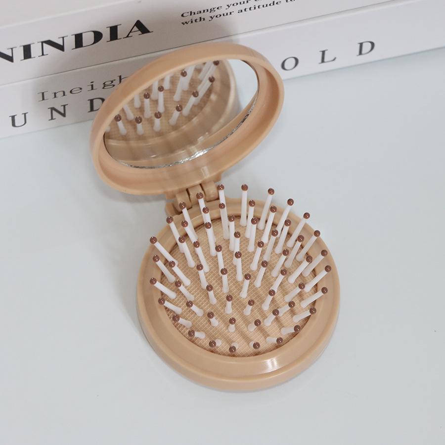 Kompakter Klappkamm & Schminkspiegel mit Airbag-Polster für Kopfmassage