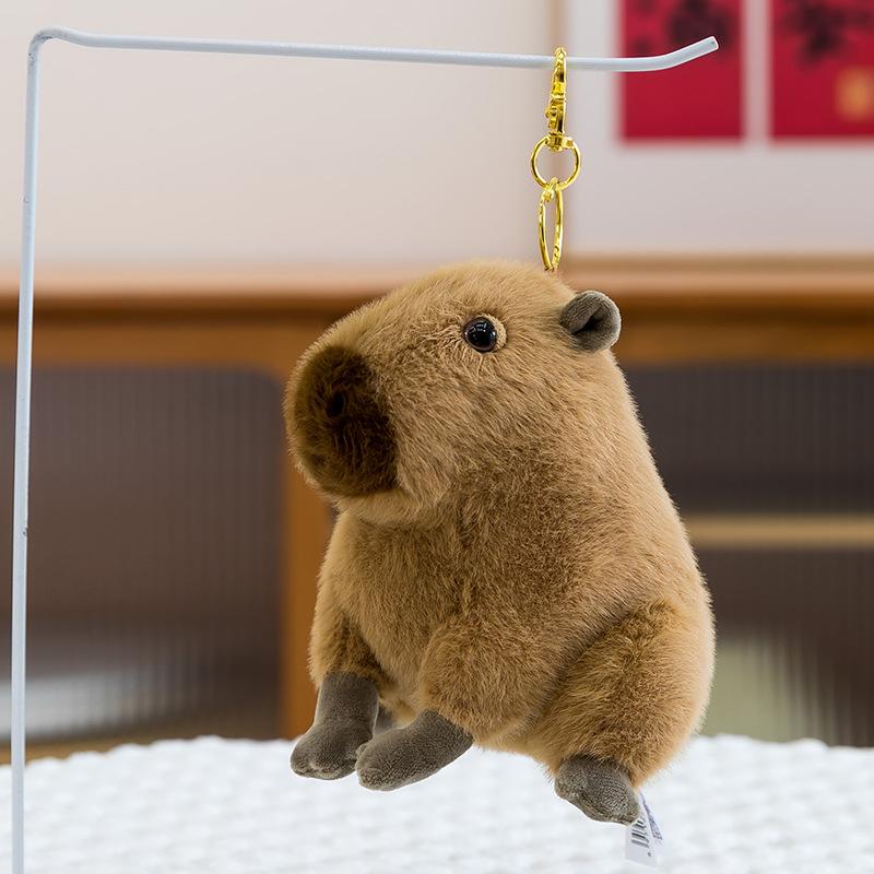 Urocza pluszowa zabawka kapibara symulacyjna poduszka do spania dla dzieci zawieszka do plecaka lalka świnka morska