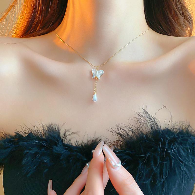 

Капающее ожерелье из жемчуга-бабочки Летняя индивидуальность Милая прохлада Цепочка на ключицу Модное милое девичье ожерелье с сердечком Ожерелье Ожерелье Ожерелье