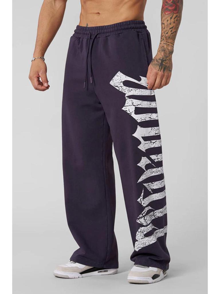 Pánské tepláky se širokými nohavicemi a velkým potiskem - Ležérní módní joggery