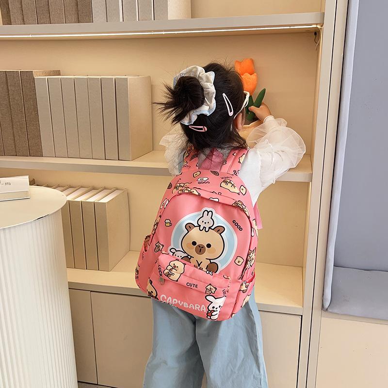 Fashion temperament Trend backpack Junior high school primary school schoolbag Large capacity decompression backpack Cartoon cute student bag