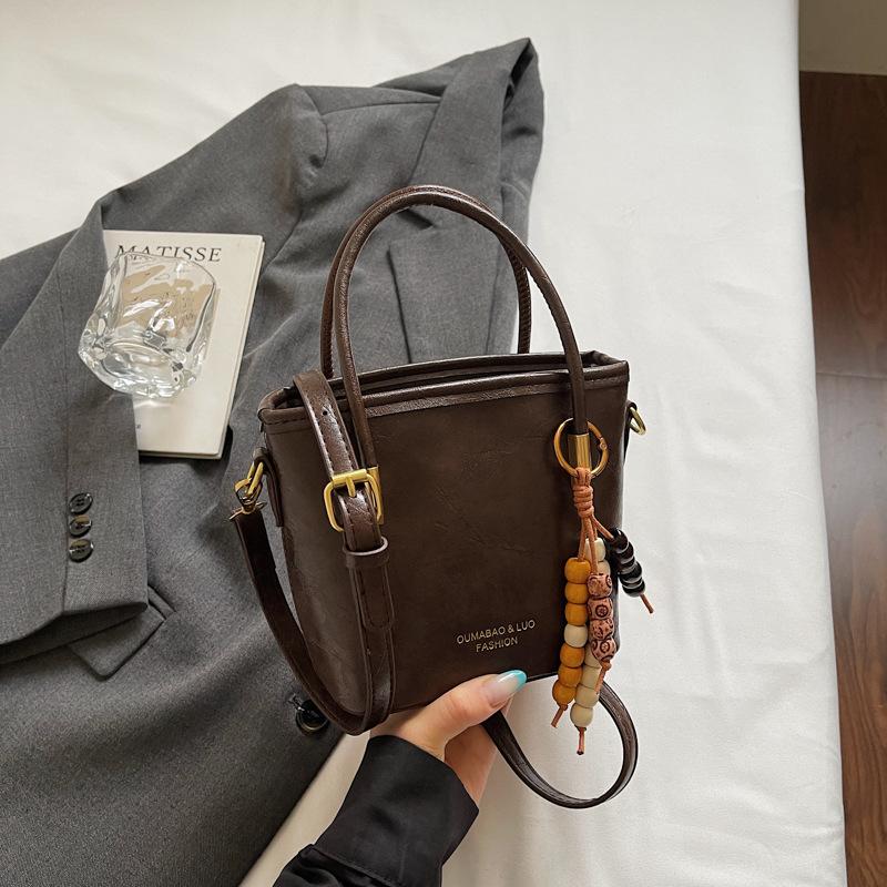 Casual retro small bag women's new fashion messenger bag commuter shoulder high value bucket bag