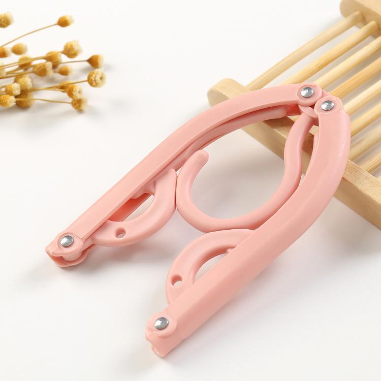 Portable Folding Non-Slip Hanger for Adults & Children - Multifunctional, Retractable, Traceless Design for Travel & Home Use.