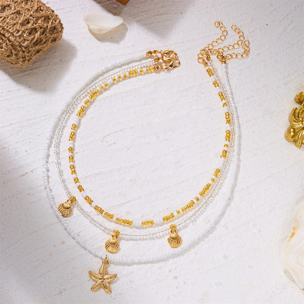 Handgefertigter mehrschichtiger gestapelter Choker aus Reiskörnern für Damen Einfacher Seestern-Muschel-Anhänger Halskette Bohemian Strand Schmuck Geschenke