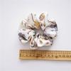 French-style smooth satin scrunchie with floral pattern, versatile elastic hair tie for women, popular on Instagram