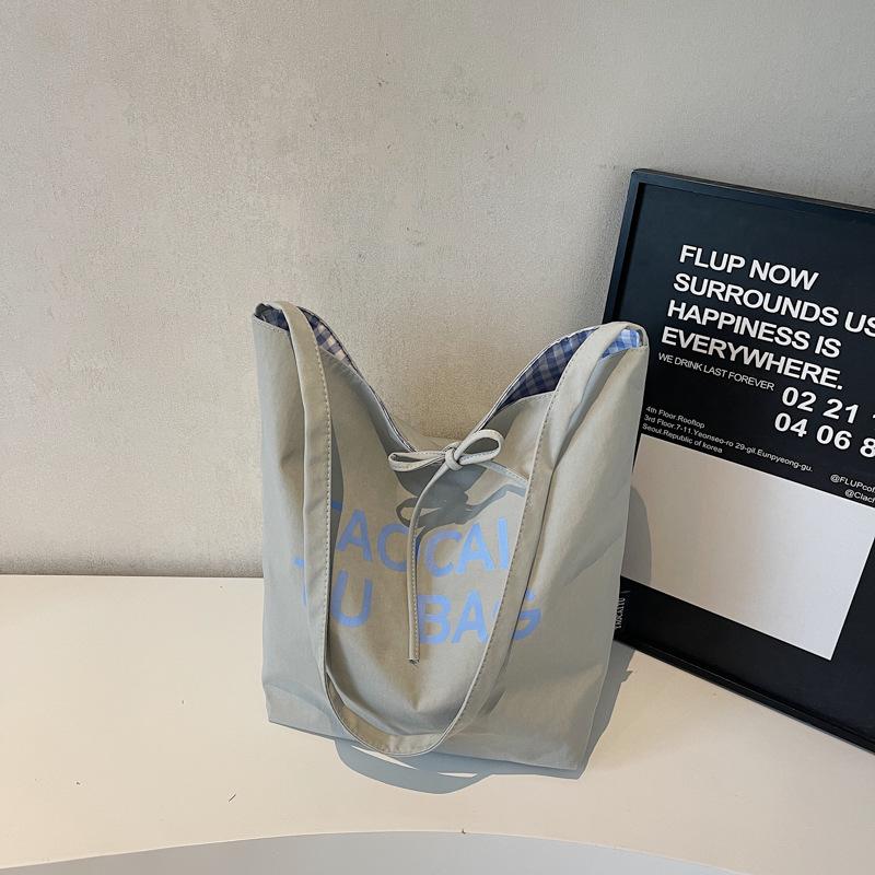 Lazy and lightweight cloth bag, tote bag, niche literary and artistic large-capacity shoulder bag, double-sided usable messenger bag.