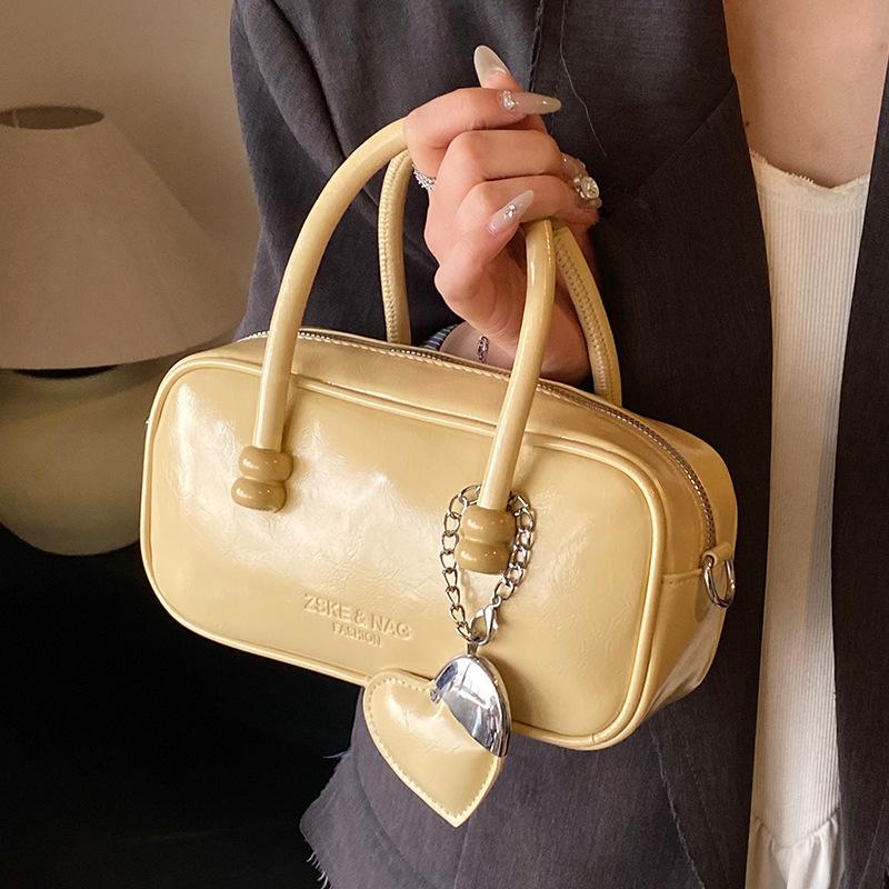 Korean Version of Fashionable Simple Retro Solid Color Portable Boston Bag Casual Versatile Solid Color Commuting Foreign Style Messenger Women's Bag