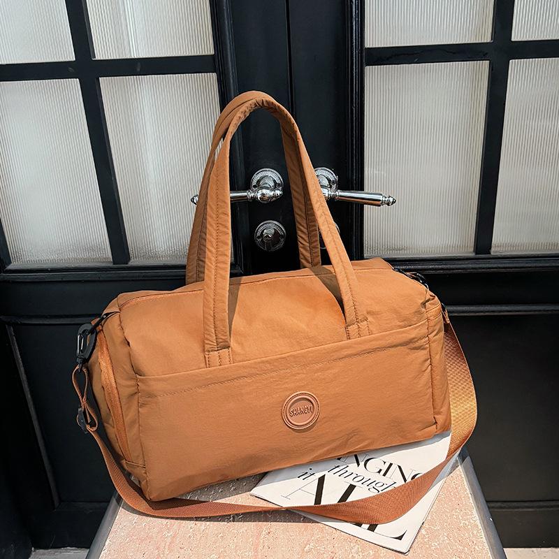 

Versatile Travel Bag: Large Capacity, Lightweight Backpack, Handbag & Crossbody with Wet/Dry Separation for Fitness & Short Trips світло-коричневого кольору