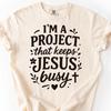 I'm A Project That Keeps Jesus Busy Comfort Colors Shirt, Funny Christian Faith Based Tee, Religious Gifts, Aesthetic Faith Gift for Her
