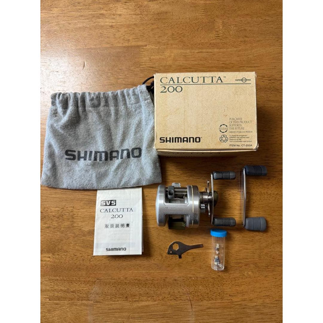 Used SHIMANO CALCUTTA 200 bait reel main body, accessories