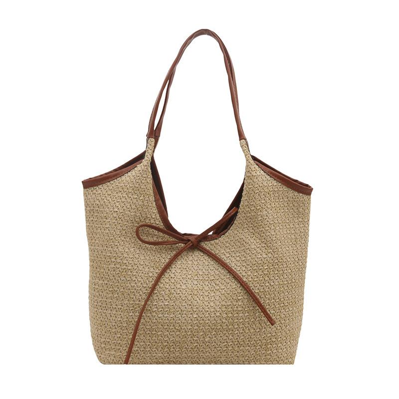 

Commuter woven large-capacity tote bag women s 2025 summer new fashion vacation straw bag bow armpit bag коричневый