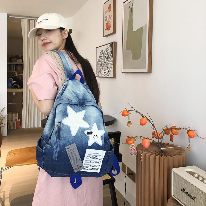 Schoolbag for middle school students, large capacity, stylish and stylish backpack, 1011 new casual travel star denim backpack