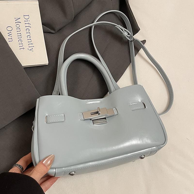 

Korean new product niche design simple portable bucket bag simple high-end sense oil wax leather commuter versatile messenger bag