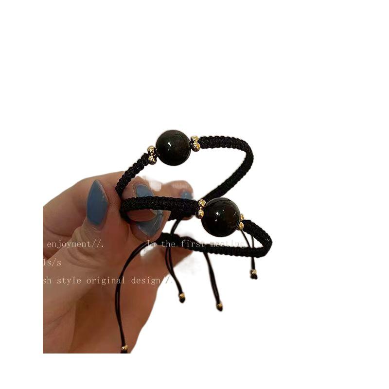

Obsidian Woven Hand Rope: Minimalist Retro Jewelry for Couples and Students Obsidian Woven Bracelet