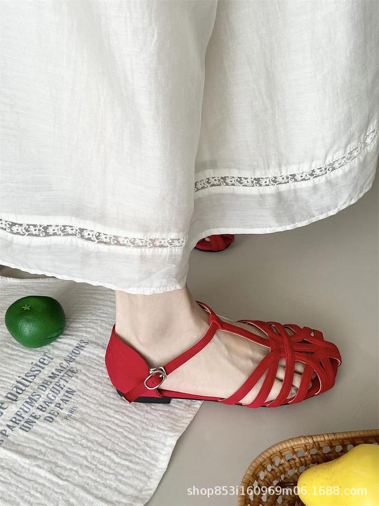 Feenwind flachbodige Schweinekäfig-Sandalen Damen 2025 Sommer neu hohl ein Riemen römisch flachbodig Tasche Kopf Sandalen Damen