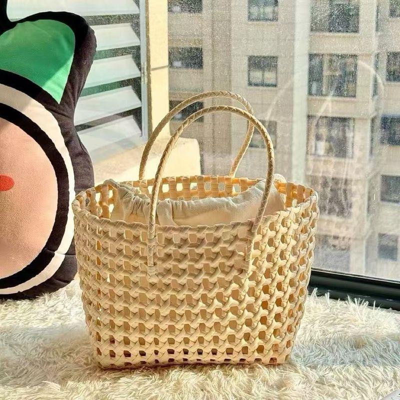 

2025 Spring and Summer Hollow Macaron Color Woven Portable Vegetable Basket Holiday Style Bag Beach Carrying French style Women s Bag Light khakis without standard delivery inner bag