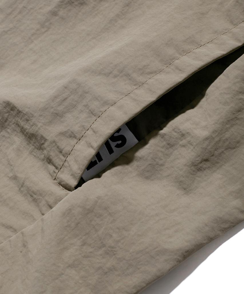 Slit Studio Lettering Windbreaker Jacket Brown