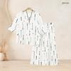 Women Plus Size Two Piece Set Round Neck Flared Half Sleeve Abstract Printed Black White Top And Long Pants