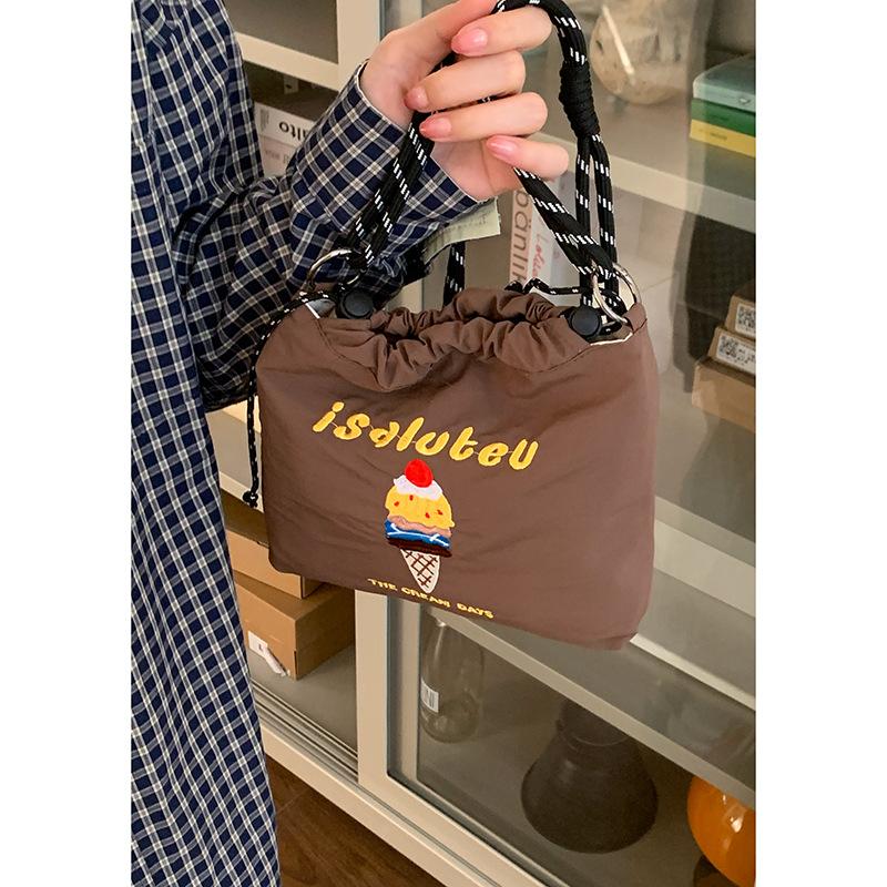 

Summer simple nylon bag women s new letter embroidered messenger bag women s cute shoulder bucket bag