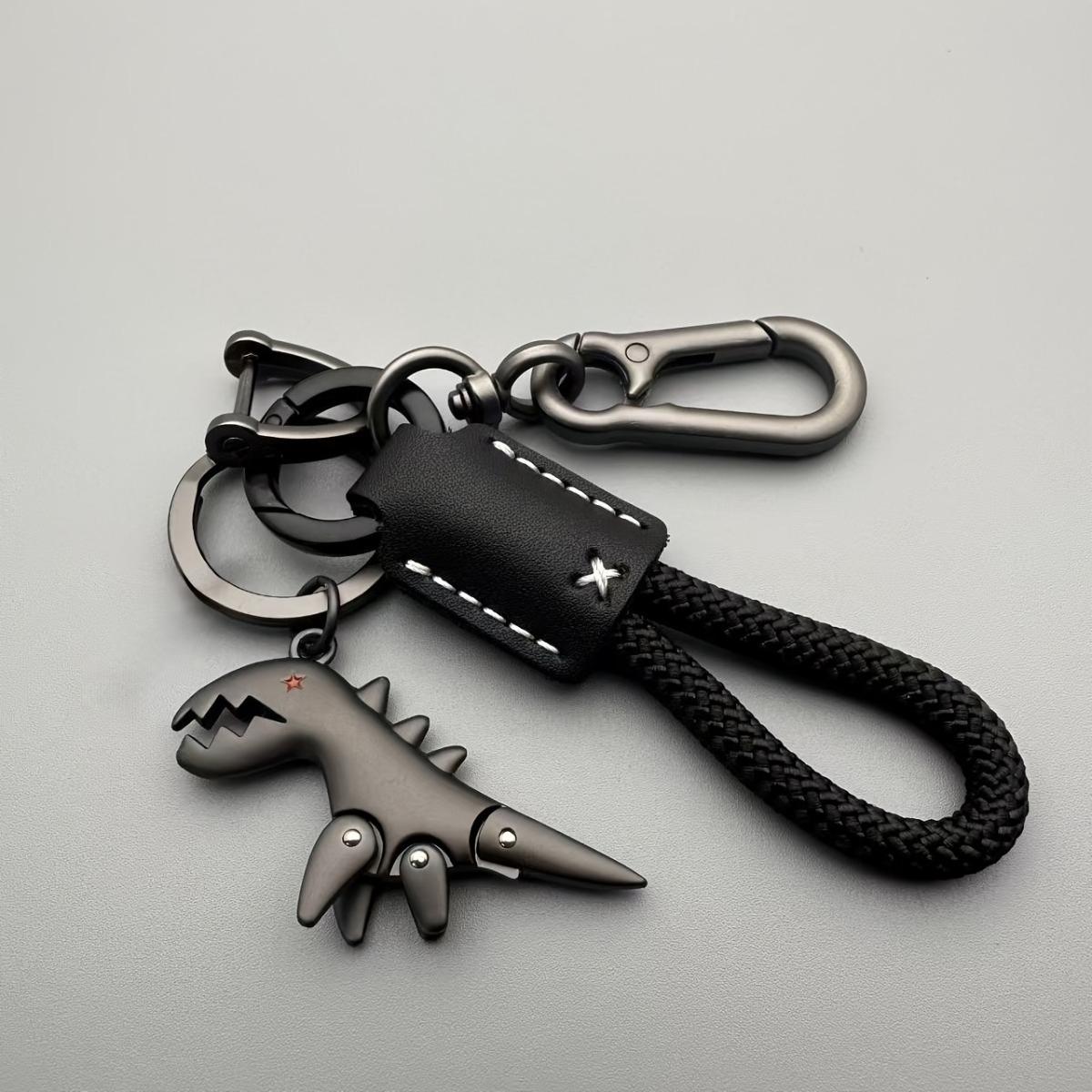 

1 cute little dinosaur keychain with a lanyard, made of aluminum alloy with a matte finish чёрный