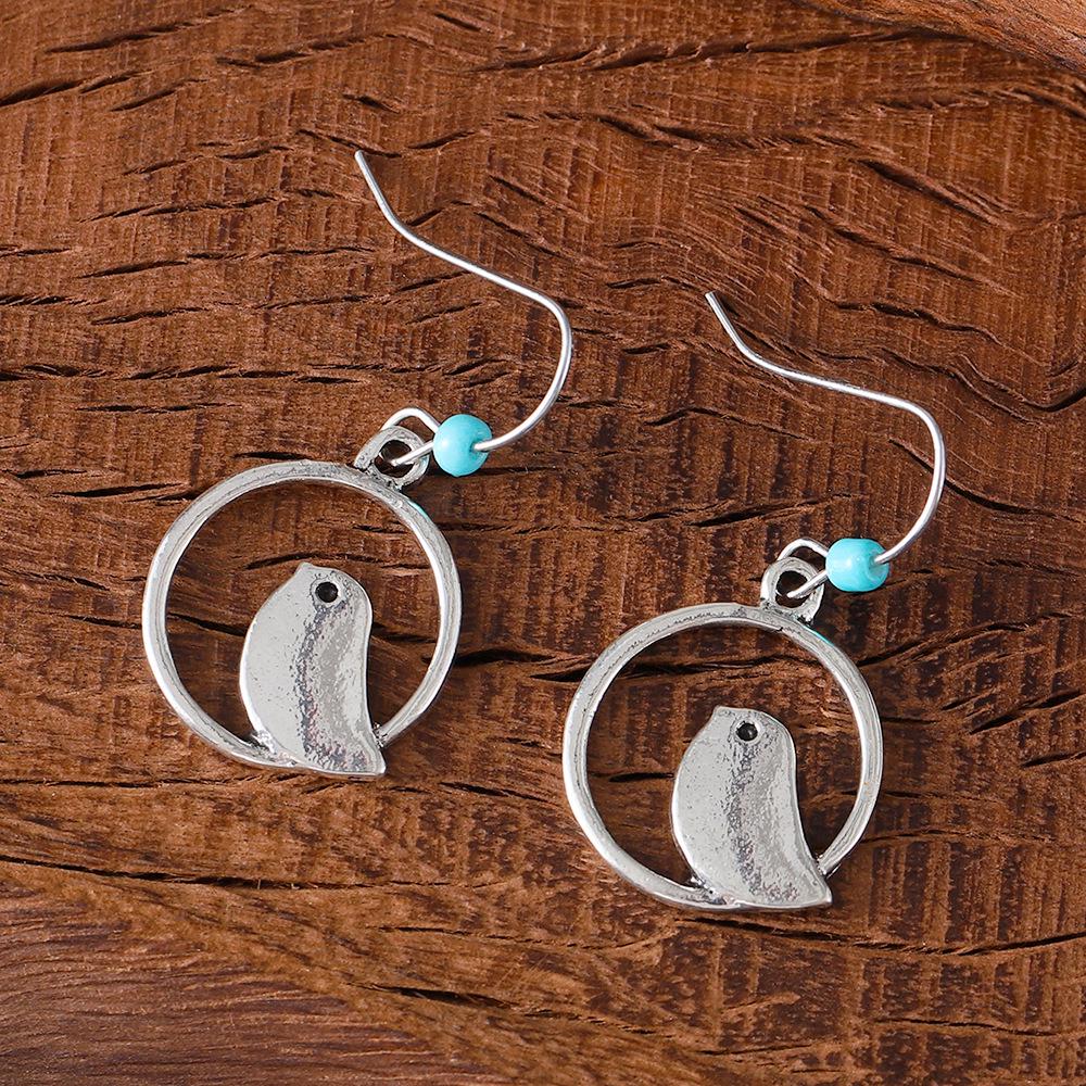 

Retro Sapphire Round Hollow Bird & Bohemian Niche Earrings