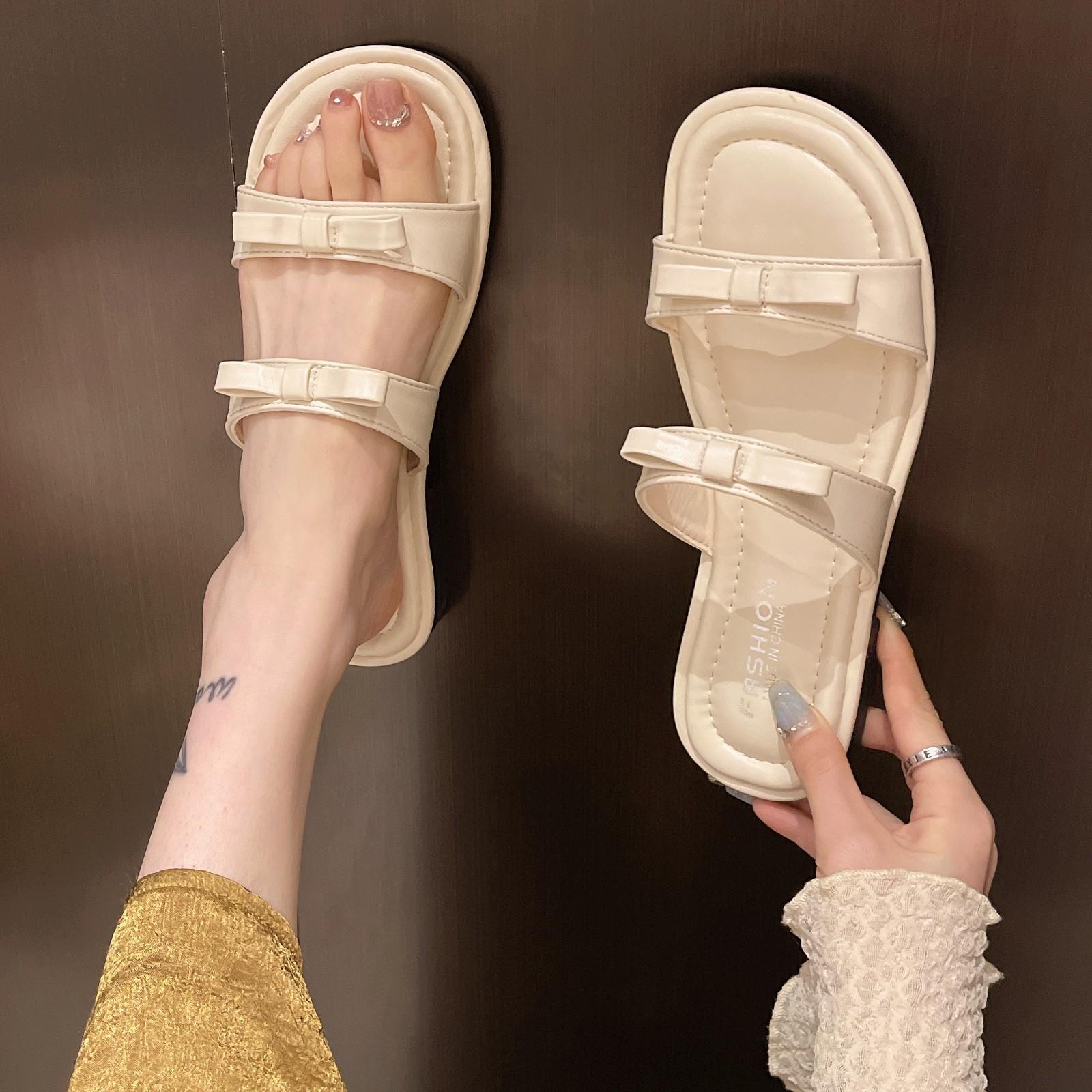 

2025 весна новая корейская версия модная простая верхняя одежда с бантом и открытым носком на плоской подошве пляжные односложные классные тапочки женские 35