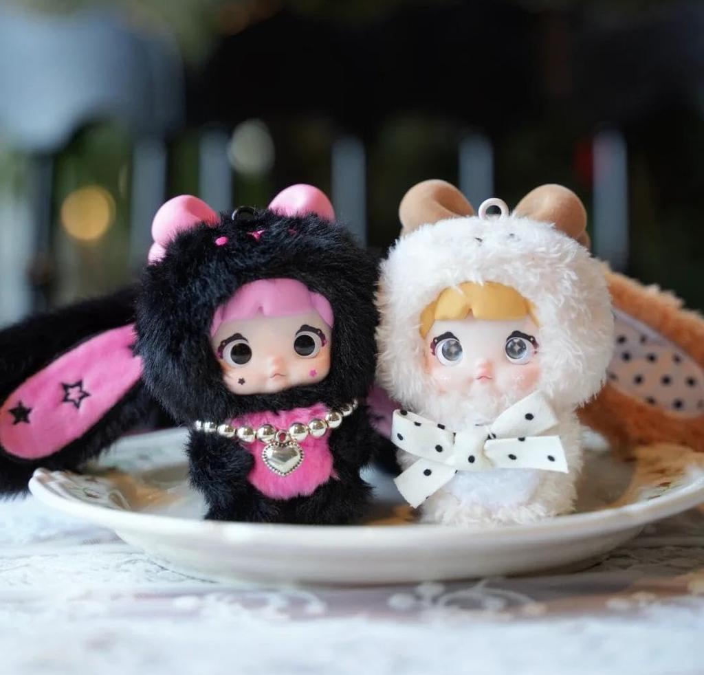 Nommi Plush Mascot Keychain Blind Box Fluffy Exterior Rigid Interior for Standing Includes 3 Rotating Perfect as a Bag Charm or Tabletop Decor 8 Types