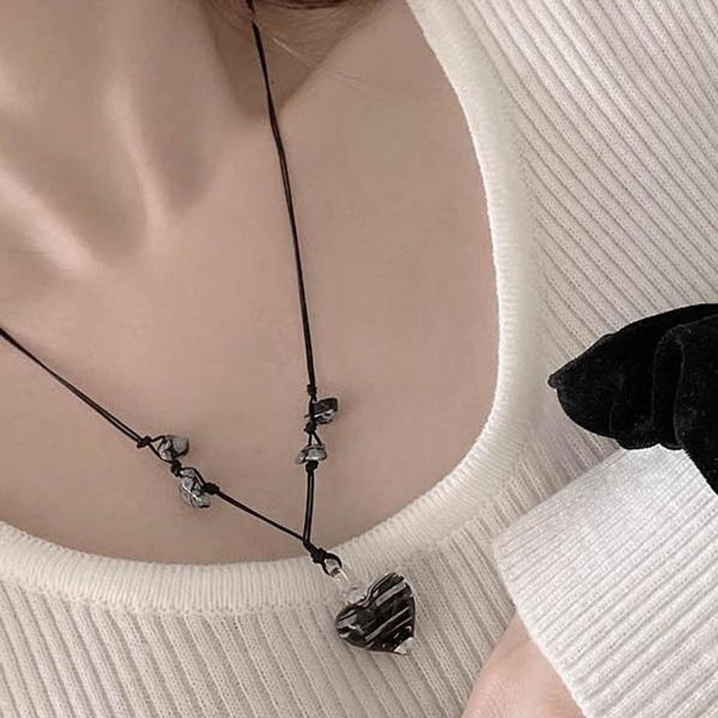 Vintage achromatic knotted glass heart necklace