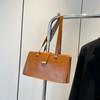 Large capacity bag women's autumn and winter retro 2025 new niche design shoulder handbag oilskin bag