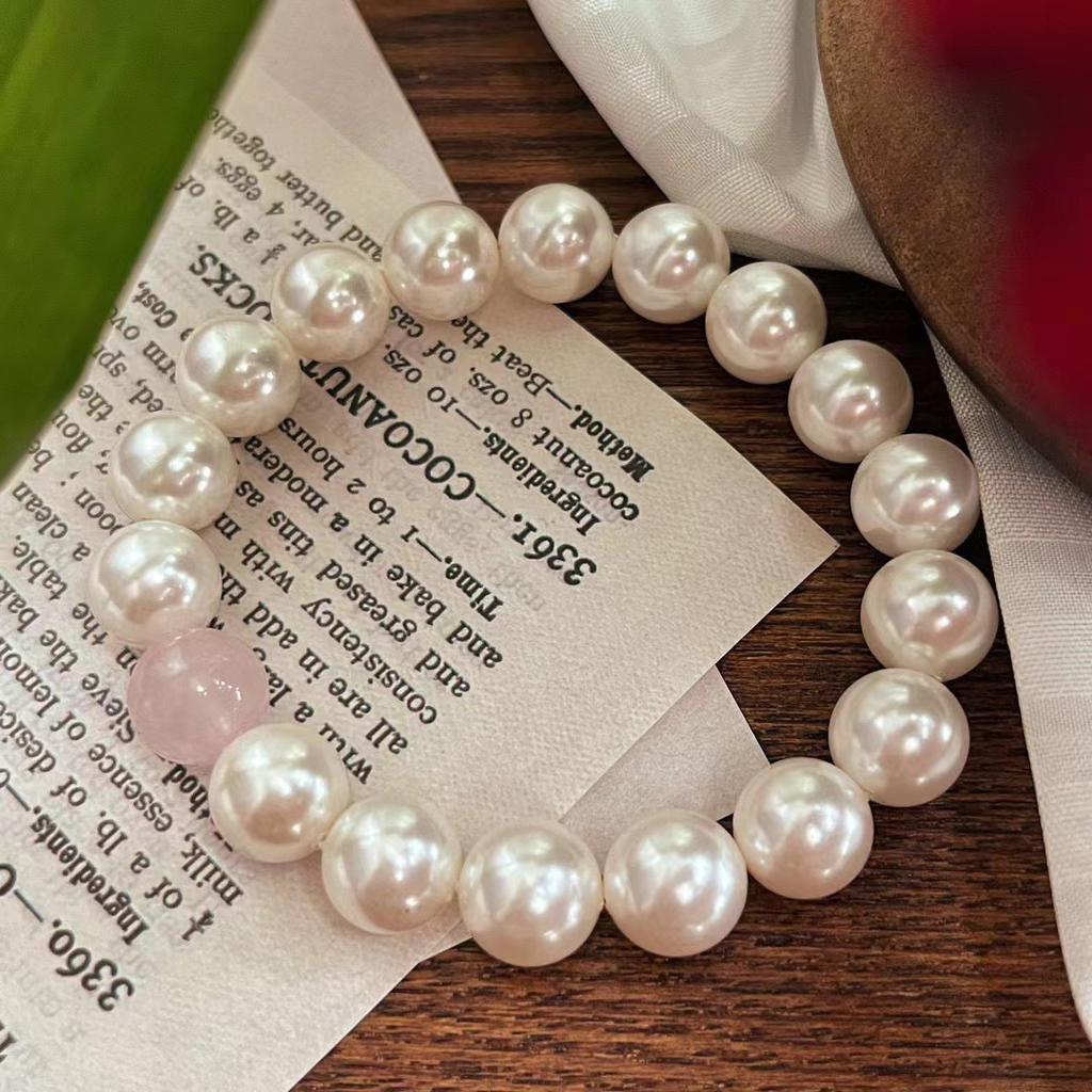 Original design, featuring a beaded pearl bracelet with natural Madagascar rose quartz beads