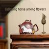 Yixing Zisha Red Clay Teapot with Engraved Flowers and Horses Design