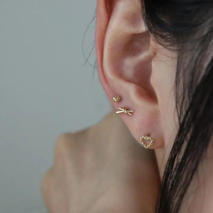 14k chain heart piercing