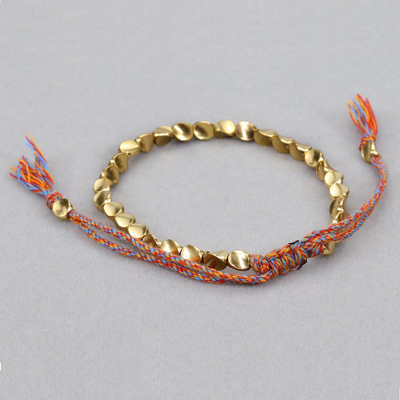 Handmade Woven Bracelet with Irregular Copper Beads and Creative Tassel Drawstring