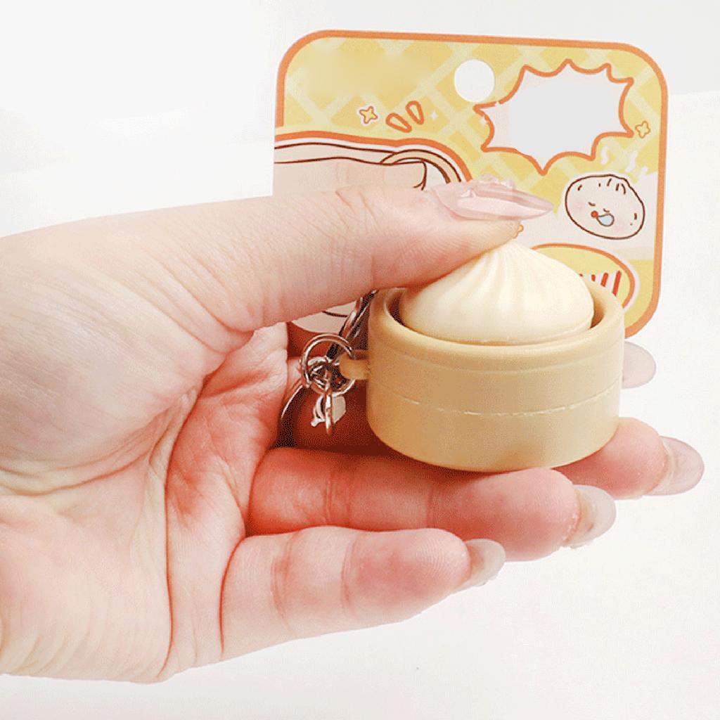 Niedlicher Schlüsselanhänger mit simuliertem gedämpftem Brötchen und Knopf-Dekompressionfunktion, Kreatives Geschenk