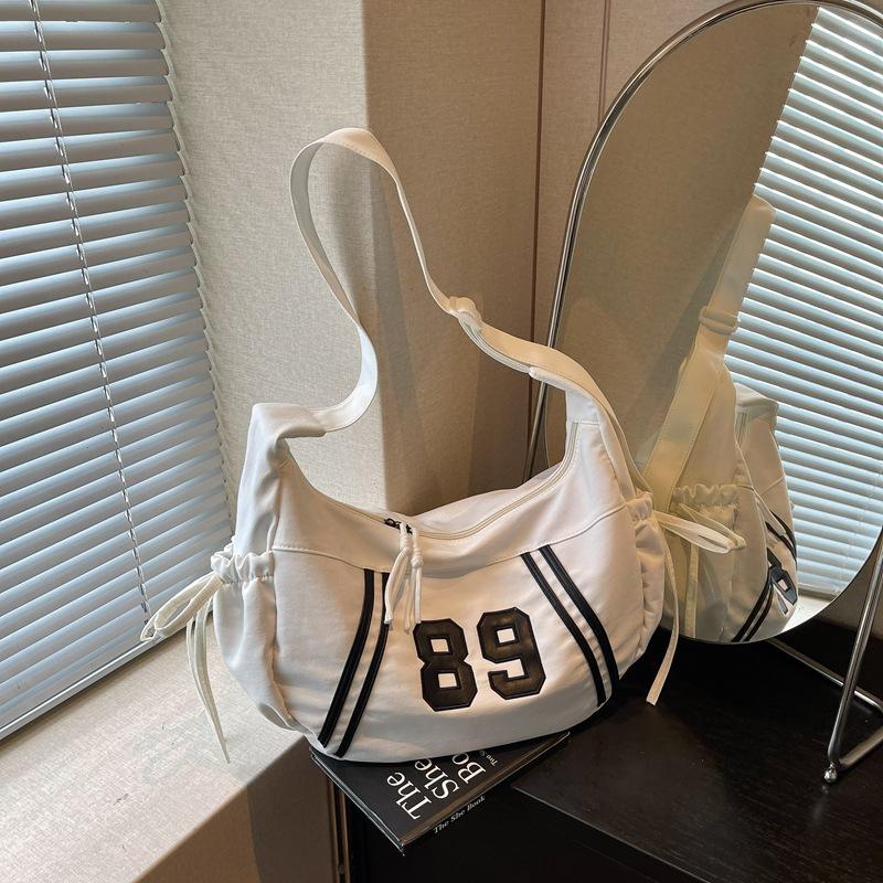 Fashionable and Unique Striped Bag for Holding Dumplings, A Casual Crossbody Bag with An Angle-hung Design At The Armpit.