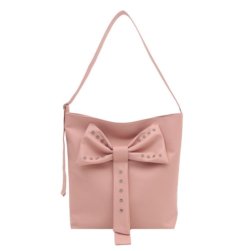 Summer large-capacity high-end sense commuting bucket bag women's 2025 new white leather bow messenger bag