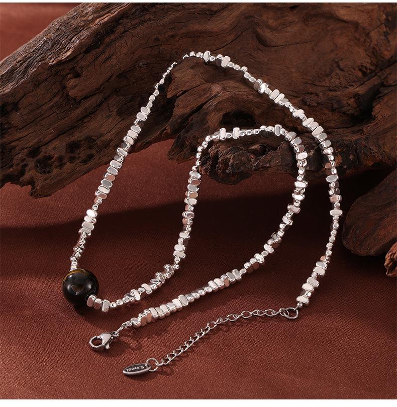 Minimalistyczny koreański naszyjnik z zawieszką z tygrysiego oka z łączonym srebrem próby 925 i designem ze stali tytanowej