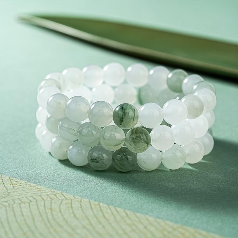 Women's Tianshan Gold Silk Jade Bracelet with White Floating Flower Design