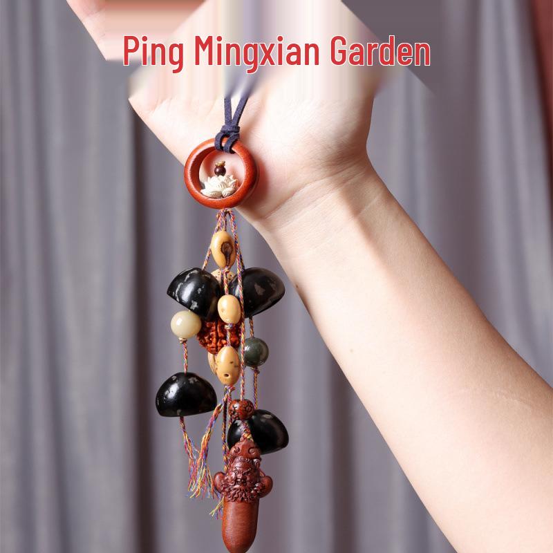 Yi Ming Xian Yuan Seed Shell Rattle Pendant: Handmade Wind Chime Bell Ornament for Backpack or Car
