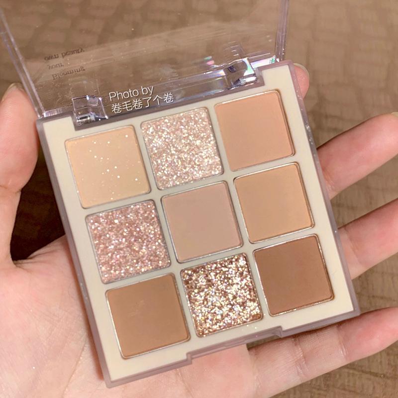 DIKALU Nine-Color Milk Tea Eyeshadow Palette: Acrylic Nude Series with Shimmer & Matte Finish.